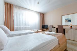 Posteľ alebo postele v izbe v ubytovaní Millennium Health Resort & Spa