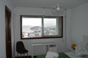 Postel nebo postele na pokoji v ubytování Fantástica vista de la Ría de Vigo en pleno centro