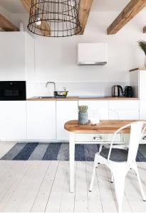 Kuchyňa alebo kuchynka v ubytovaní PM1-apartament