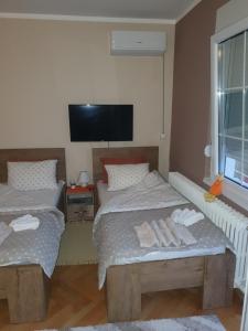 Ένα ή περισσότερα κρεβάτια σε δωμάτιο στο Guest House Jasmin