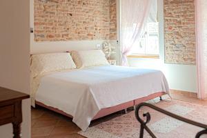 Posteľ alebo postele v izbe v ubytovaní Il Giardino sul Tetto B&B