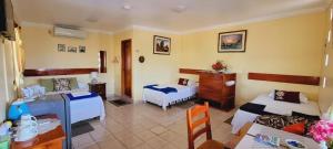 Voodi või voodid majutusasutuse Hostal Romy toas
