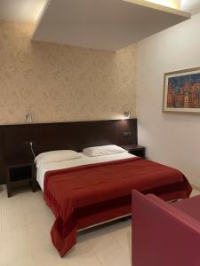 Cama ou camas em um quarto em Hotel De Petris