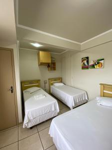 Katil atau katil-katil dalam bilik di Andardac Hotel
