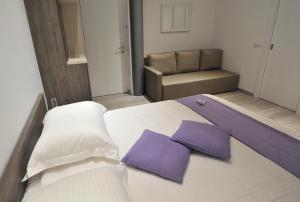 Posteľ alebo postele v izbe v ubytovaní Apartments & Rooms Lavandula Exclusive