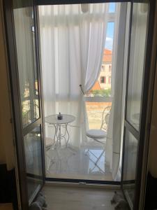 a view of a balcony with a table and chairs at Ghibellines Apartments in Verona