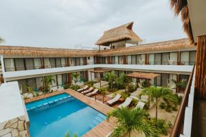 A view of the pool at Hotel Boutique Naj Casa Holbox or nearby