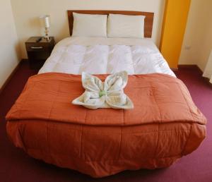 Säng eller sängar i ett rum på Marlon's House Puno-Peru