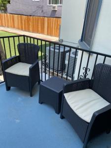 two chairs and a table on a balcony at The Wilshire Metro in Los Angeles