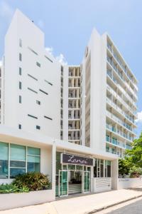 an image of a white apartment building at Lanai Riverside Apartments in Mackay