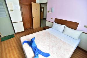 Postel nebo postele na pokoji v ubytování Krabi Grand Hotel