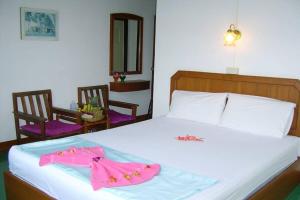 Postel nebo postele na pokoji v ubytování Krabi Grand Hotel