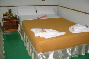 Postel nebo postele na pokoji v ubytování Krabi Grand Hotel