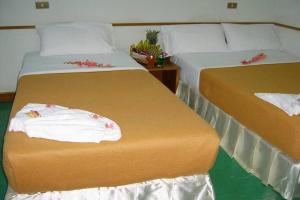 Postel nebo postele na pokoji v ubytování Krabi Grand Hotel