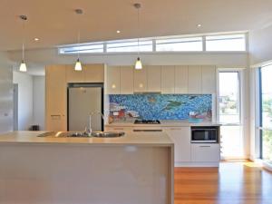 a kitchen with a sink and a counter top at Scarborough Serenity in Inverloch