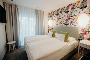 Postel nebo postele na pokoji v ubytování Hotel Crystal