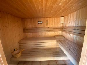a wooden sauna with a toilet in it at Dorina wellness in Siófok