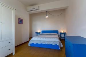 Villa Pierina tesisinde bir odada yatak veya yataklar