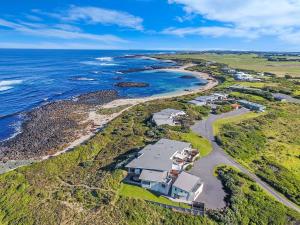 an aerial view of a house next to the ocean at Hearns Beachside Villa 8 in Port Fairy