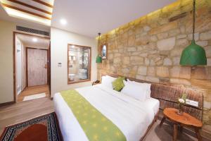 Voodi või voodid majutusasutuse Woodapple Hotel and Spa toas
