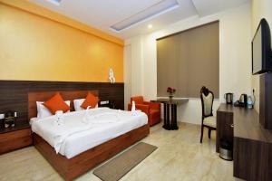 TV a/nebo společenská místnost v ubytování Hotel Bhaskar