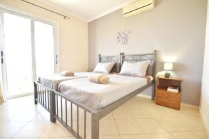 Posteľ alebo postele v izbe v ubytovaní Konomi Residence