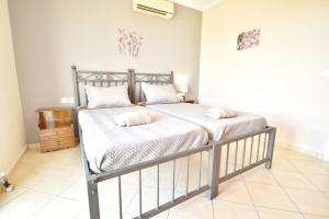 Posteľ alebo postele v izbe v ubytovaní Konomi Residence