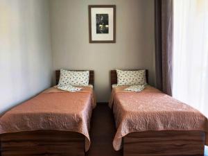 Ένα ή περισσότερα κρεβάτια σε δωμάτιο στο Коттедж Крепкий Орешек