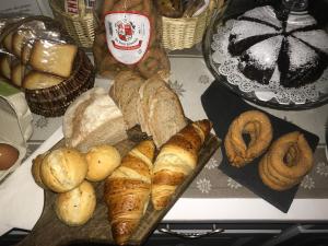 a bunch of different types of bread and pastries on a table at Aymon de Challant in Aosta