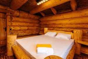 מיטה או מיטות בחדר ב-Kottege Riverun