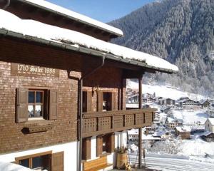 a building with a sign that says tko ski pass at Haus Saler in Gaschurn