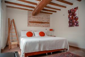 Posteľ alebo postele v izbe v ubytovaní Il Giardino sul Tetto B&B