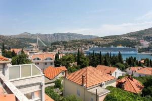 a view of a city with a cruise ship in the water at Apartment Lala in Dubrovnik