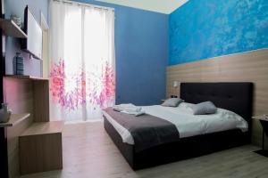 Postel nebo postele na pokoji v ubytování Mini Hotel Wf2 Caltagirone