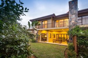 an exterior view of a house with a yard at Zimbali Holiday Home - 3 Baluwatu in Durban