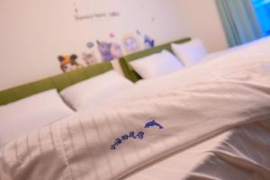 Uma cama ou camas num quarto em Baby Dolphin