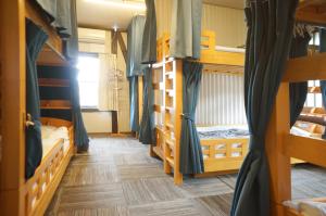 Voodi või voodid majutusasutuse Sakura Guest House toas