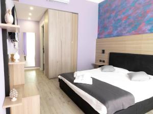 Postel nebo postele na pokoji v ubytování Mini Hotel Wf2 Caltagirone