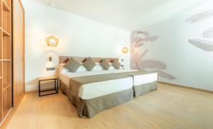 a bedroom with a large bed in a room at DWO Nopal in Puerto de la Cruz