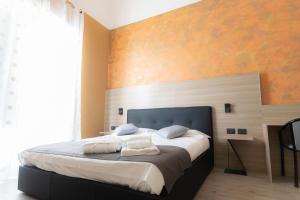 Postel nebo postele na pokoji v ubytování Mini Hotel Wf2 Caltagirone