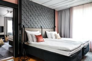 A bed or beds in a room at Original Sokos Hotel Arina Oulu