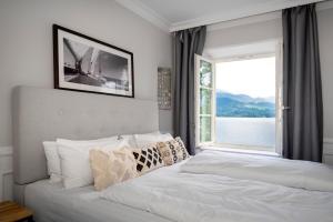 Un pat sau paturi într-o cameră la Villa Palazzo