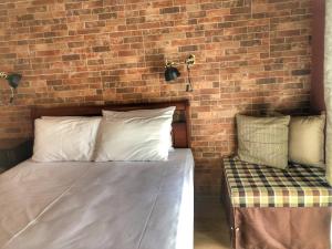 A bed or beds in a room at Guesthouse Monopati - Ξενώνας Μονοπάτι