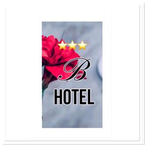a hotel sign with stars and a red flower at Business Hotel in Magnitogorsk