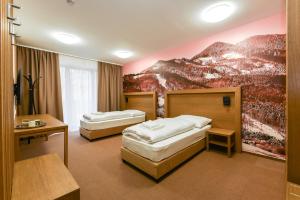 Postel nebo postele na pokoji v ubytování Apartmány Humno