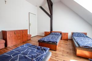 Posteľ alebo postele v izbe v ubytovaní Ośrodek Szkoleniowo - Noclegowy Chojnik