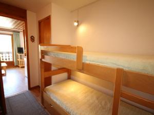 two bunk beds in a room with a hallway at Studio Les Saisies, 1 pièce, 4 personnes - FR-1-293-14 in Les Saisies