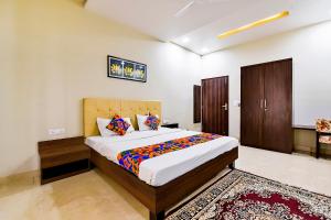a bedroom with a large bed in a room at FabHotel The Castle Homestay in Jaipur +21 photos