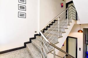 a staircase in a building with a stair case at FabHotel The Castle Homestay in Jaipur