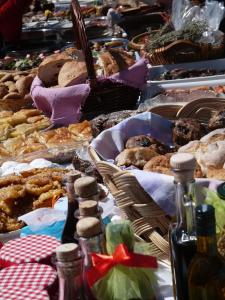 a table filled with lots of different types of food at Roxani Country House Resort in Maronia